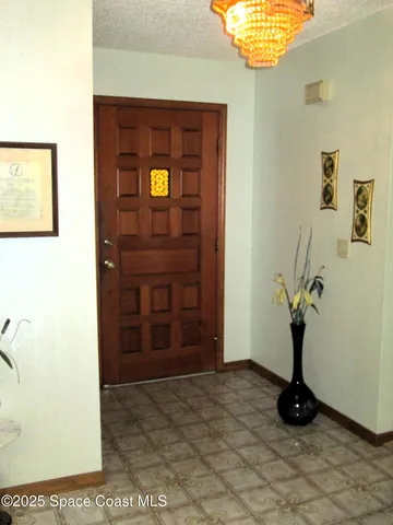 a view of entryway with a front door