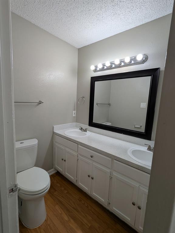 514 East Belt Line Road, Unit B13 DeSoto, TX 75115 - Photo 19 of 28 a bathroom with a toilet sink and mirror