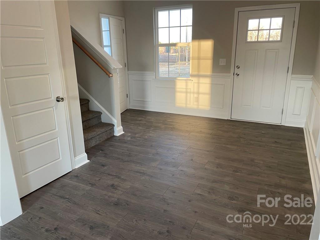 4025 Pigg Mattox Road Monroe, NC 28112 - Photo 16 of 18 a view of an empty room with wooden floor and a window