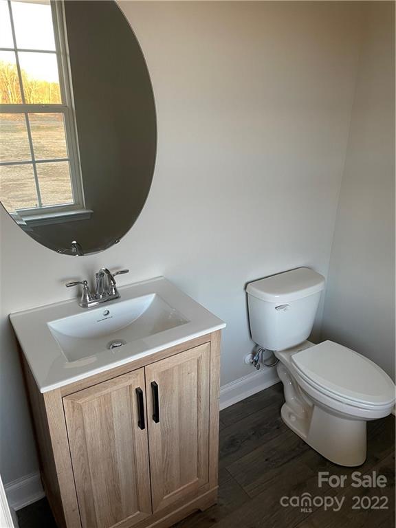 4025 Pigg Mattox Road Monroe, NC 28112 - Photo 18 of 18 a bathroom with a toilet sink and mirror
