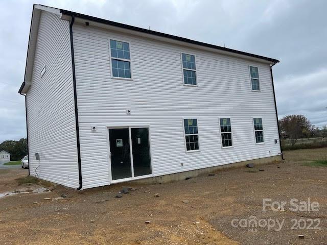 4025 Pigg Mattox Road Monroe, NC 28112 - Photo 5 of 18 a view of a house with a backyard