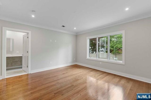 211 Warwick Avenue, Unit 1 Fort Lee, NJ 07024 - Photo 17 of 43 wooden floor in an empty room with a window