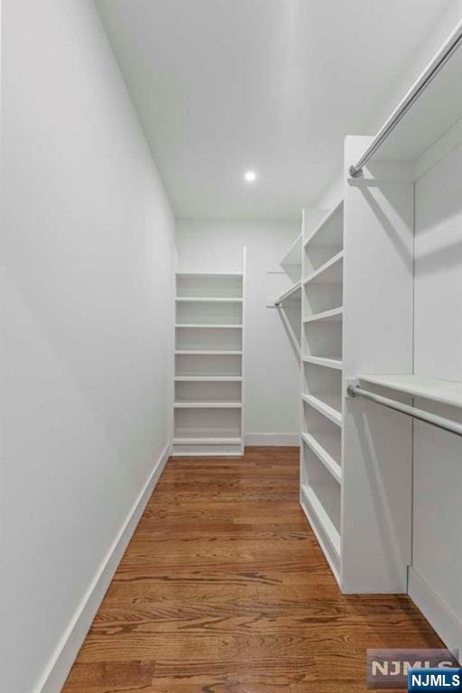 211 Warwick Avenue, Unit 1 Fort Lee, NJ 07024 - Photo 20 of 43 a view of walk in closet with empty racks