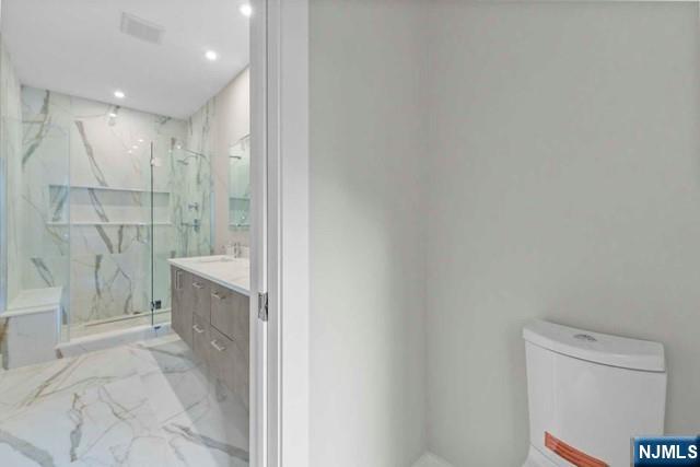 211 Warwick Avenue, Unit 1 Fort Lee, NJ 07024 - Photo 23 of 43 a bathroom with a sink a toilet and shower