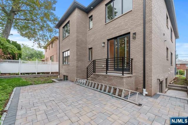 211 Warwick Avenue, Unit 1 Fort Lee, NJ 07024 - Photo 38 of 43 a front view of a house with garden