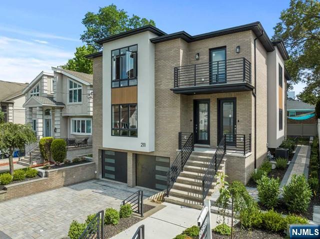 211 Warwick Avenue, Unit 1 Fort Lee, NJ 07024 - Photo 4 of 43 a front view of a house with glass windows