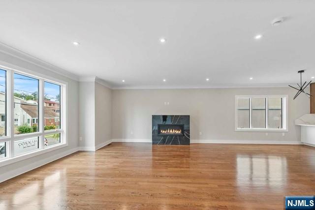 211 Warwick Avenue, Unit 1 Fort Lee, NJ 07024 - Photo 6 of 43 a view of empty room with wooden floor and fan