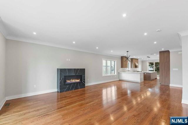 211 Warwick Avenue, Unit 1 Fort Lee, NJ 07024 - Photo 10 of 43 a view of a livingroom with wooden floor