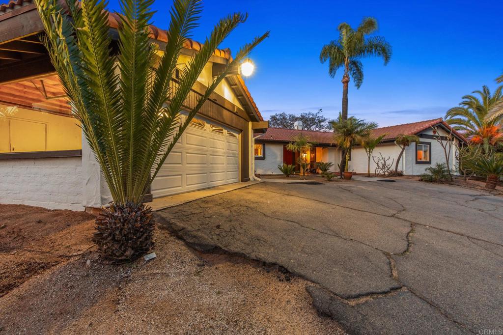 28969 Mountain Meadow Road Escondido, CA 92026 - Photo 11 of 25 a front view of a house with a yard
