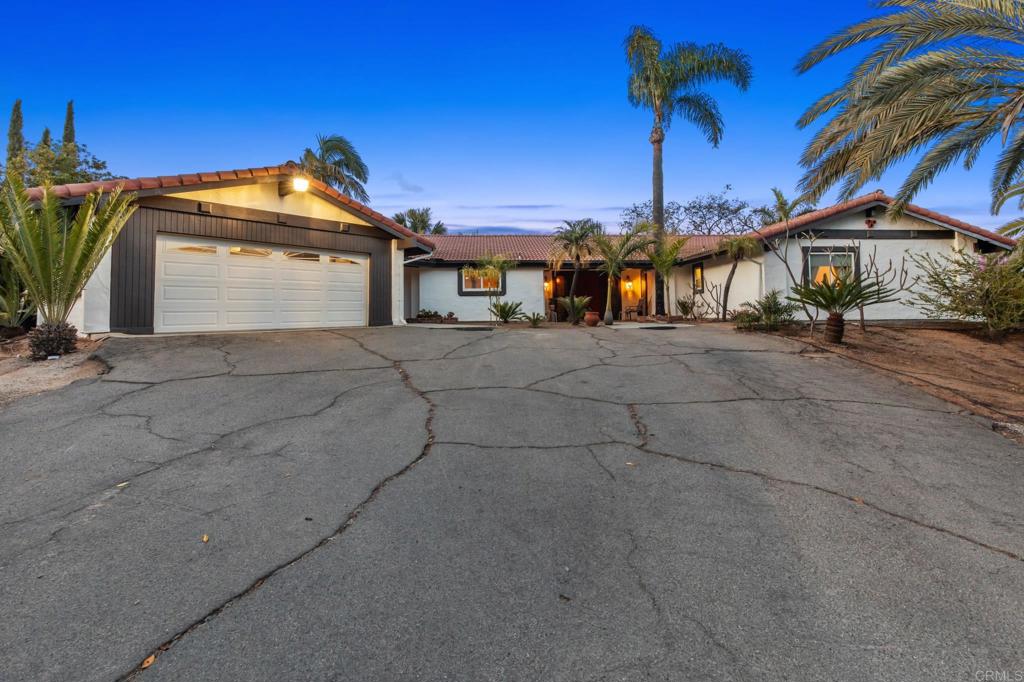 28969 Mountain Meadow Road Escondido, CA 92026 - Photo 12 of 25 a view of a house with a yard and a street