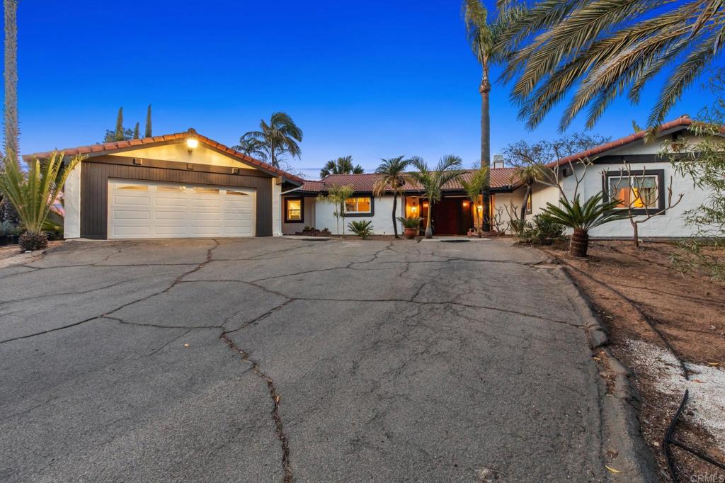 28969 Mountain Meadow Road Escondido, CA 92026 - Photo 16 of 25 a view of a house with a yard