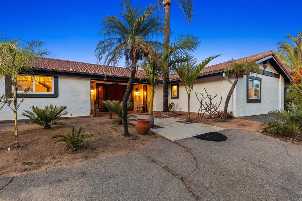 28969 Mountain Meadow Road Escondido, CA 92026 - Photo 4 of 25 a view of a house with backyard and swimming pool