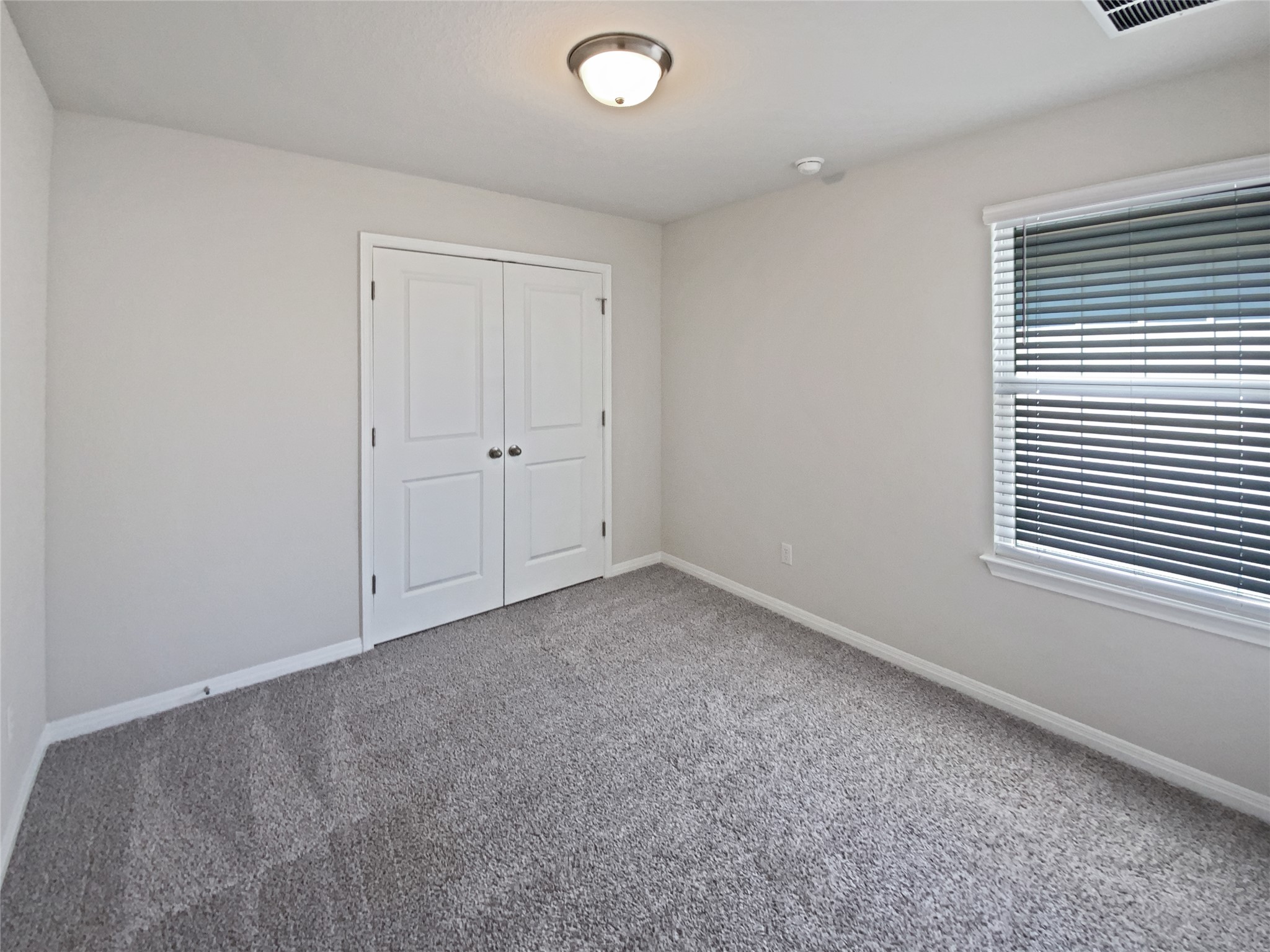 220 Sungrove Trail Georgetown, TX 78628 - Photo 20 of 23 Unfurnished bedroom with carpet floors and a closet