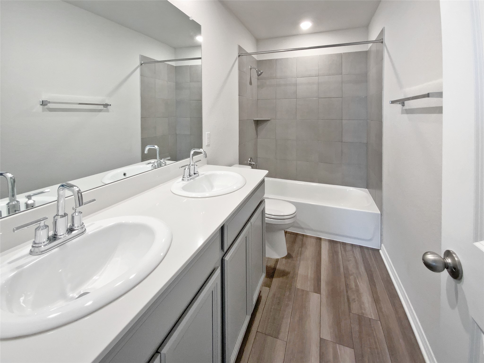 220 Sungrove Trail Georgetown, TX 78628 - Photo 21 of 23 Full bathroom featuring shower / washtub combination, dark wood finished floors, and double vanity