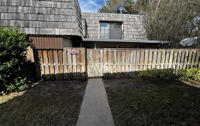 a view of a pathway with a garden