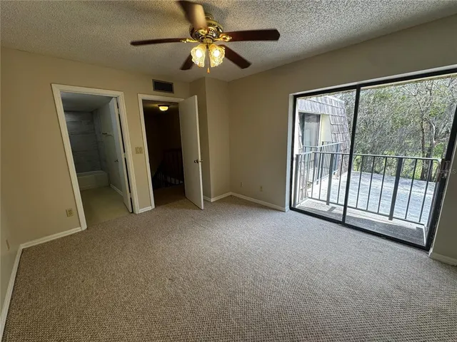 a bathroom with a granite countertop sink a mirror and a shower