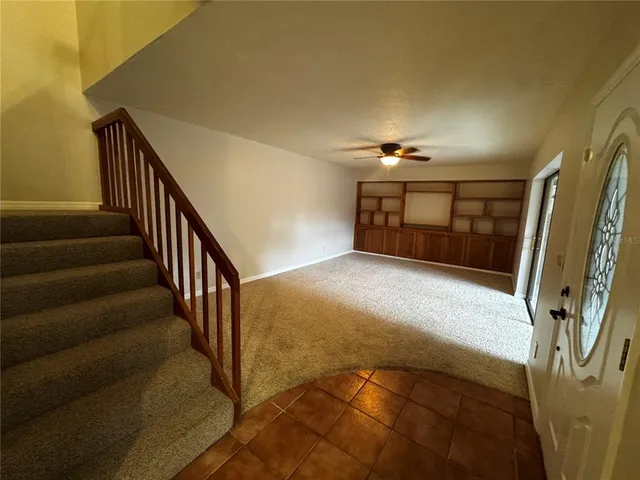 a bedroom with bed and a window