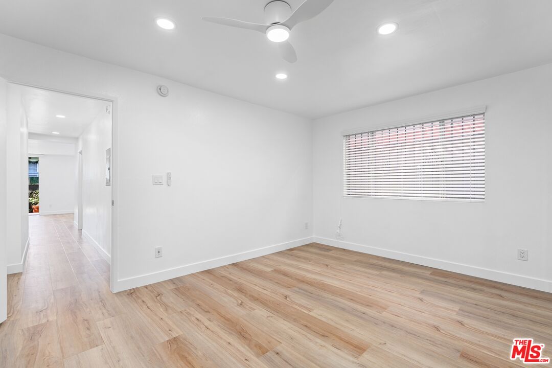 122 Buccaneer Street, Unit 1 Marina del Rey, CA 90292 - Photo 15 of 21 wooden floor in an empty room with a window