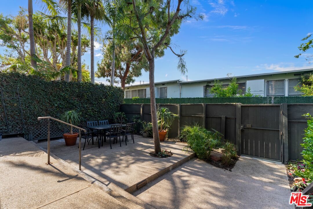 122 Buccaneer Street, Unit 1 Marina del Rey, CA 90292 - Photo 19 of 21 a view of a chairs and table in backyard
