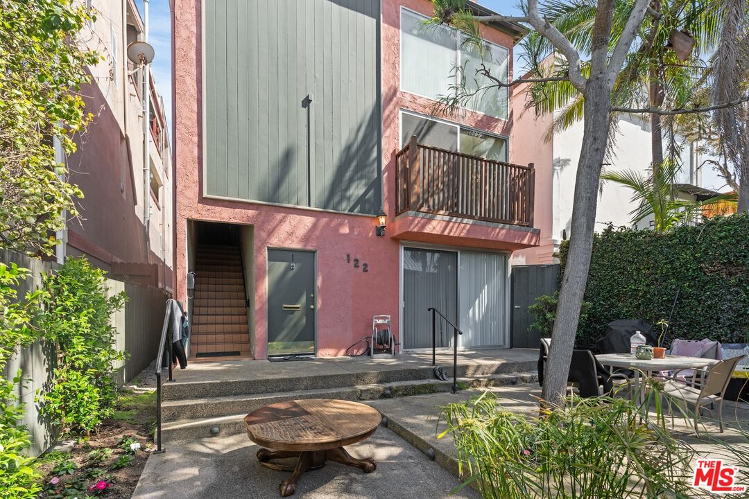 122 Buccaneer Street, Unit 1 Marina del Rey, CA 90292 - Photo 2 of 21 a front view of a building with sitting area