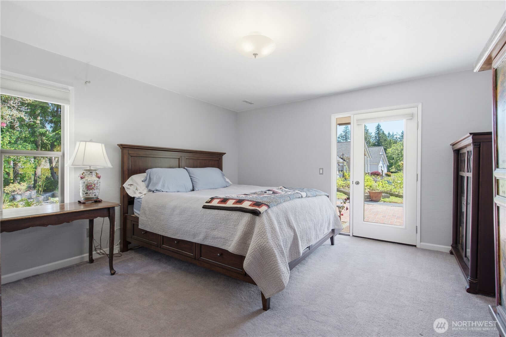 3050 Southeast Mullenix Road Port Orchard, WA 98367 - Photo 14 of 40 a bedroom with a bed and a window
