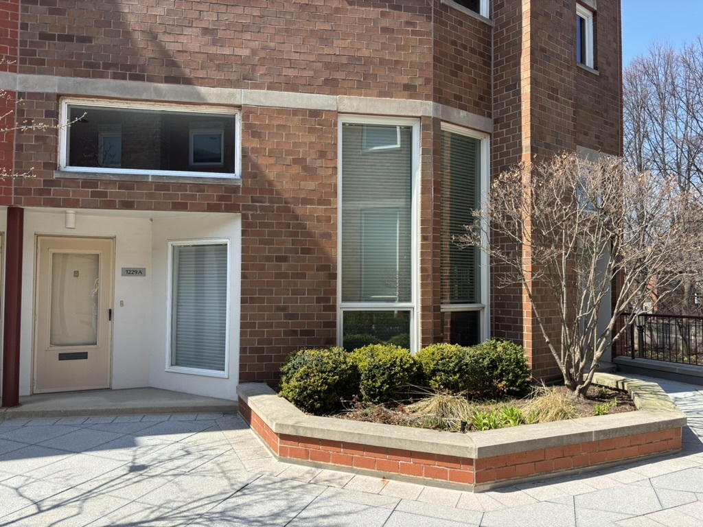 1229 Central Street, Unit A Evanston, IL 60201 - Photo 1 of 14 a front view of a house with entryway