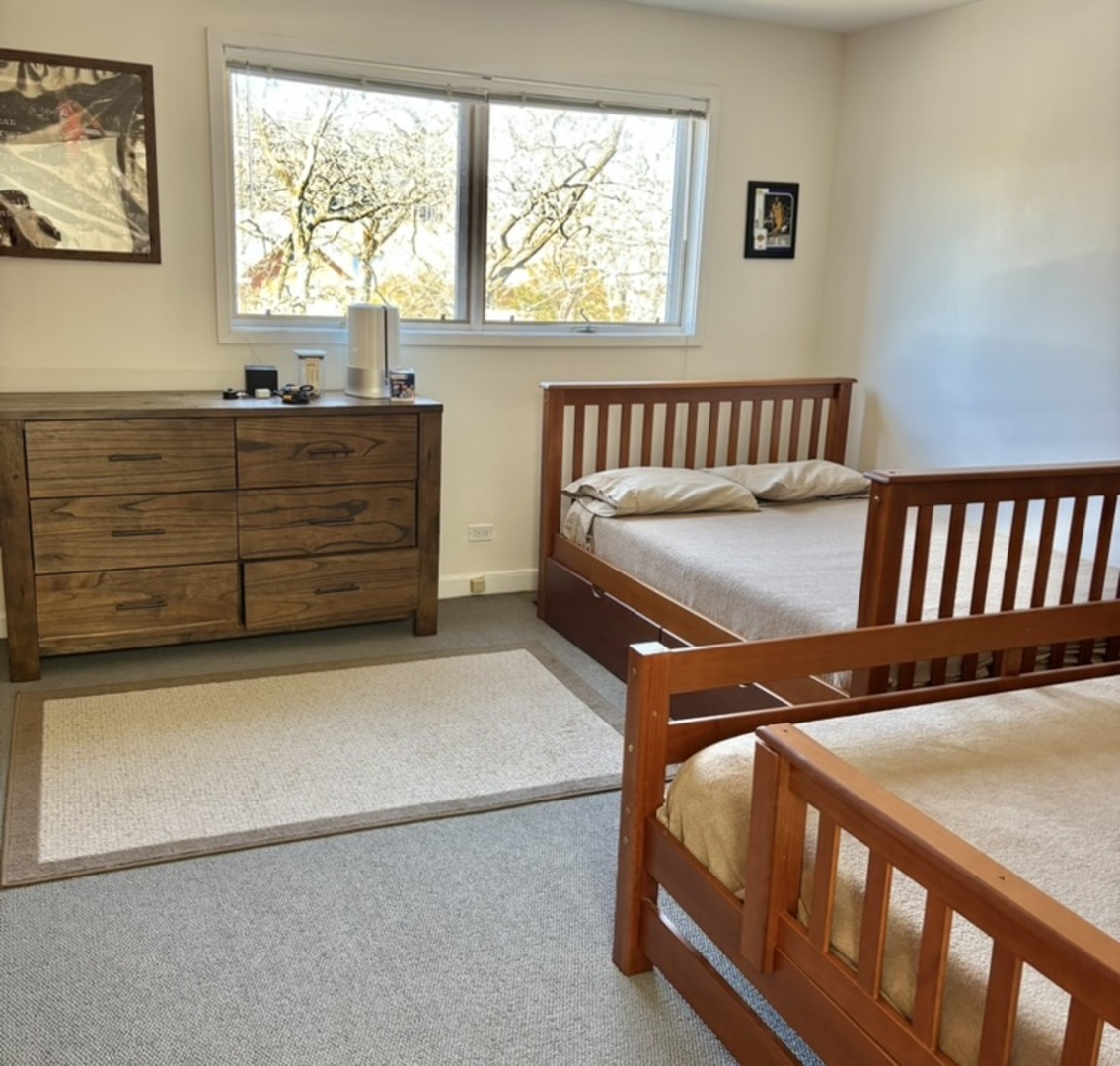 1229 Central Street, Unit A Evanston, IL 60201 - Photo 7 of 14 a bedroom with bed and window