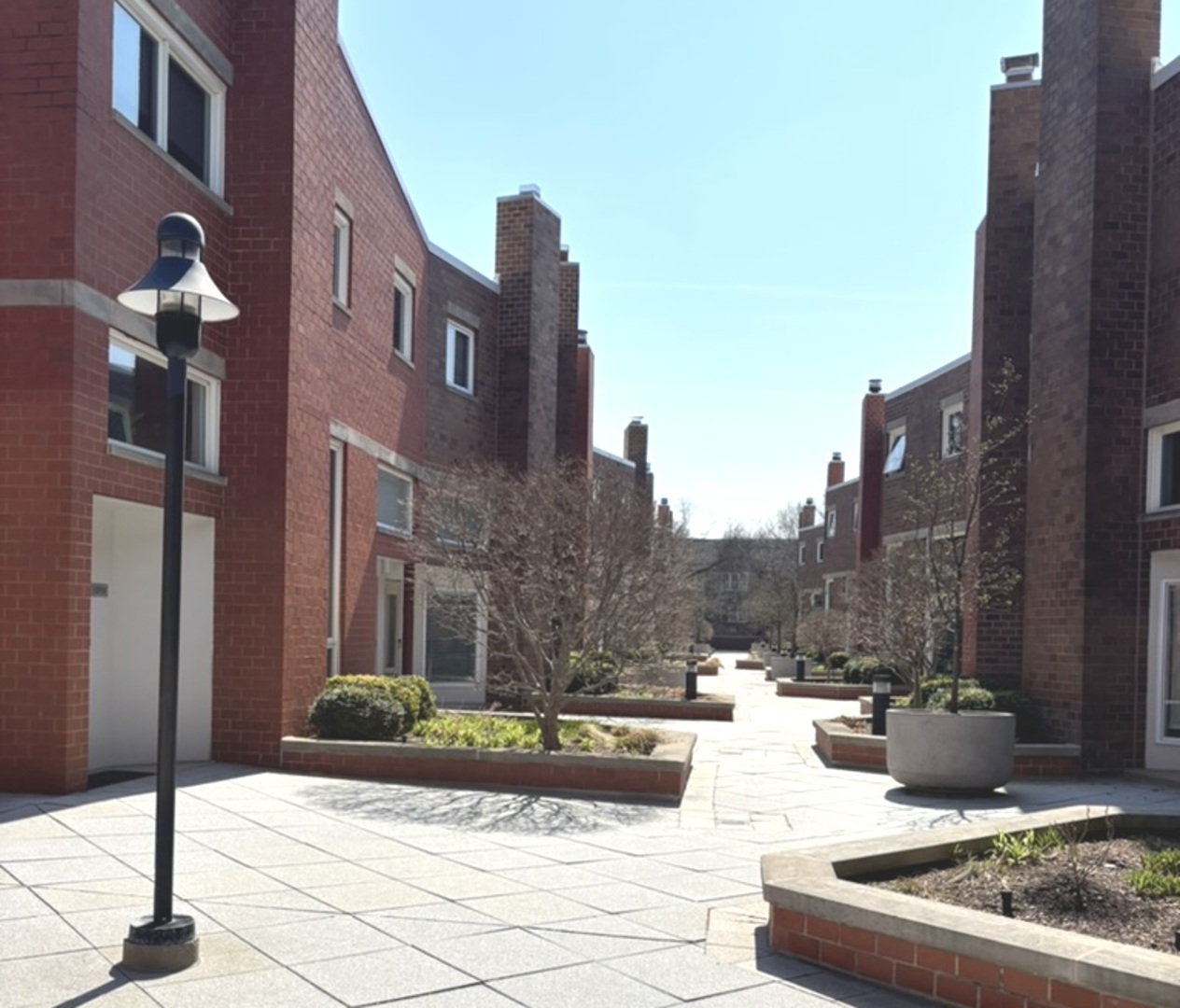 1229 Central Street, Unit A Evanston, IL 60201 - Photo 10 of 14 a view of a yard in front of a building