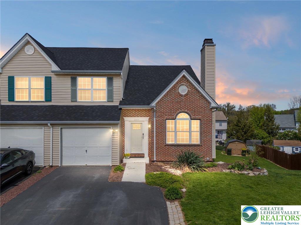 2309 Juniper Drive Coplay, PA 18037 - Photo 2 of 49 a front view of a house with a yard and garage