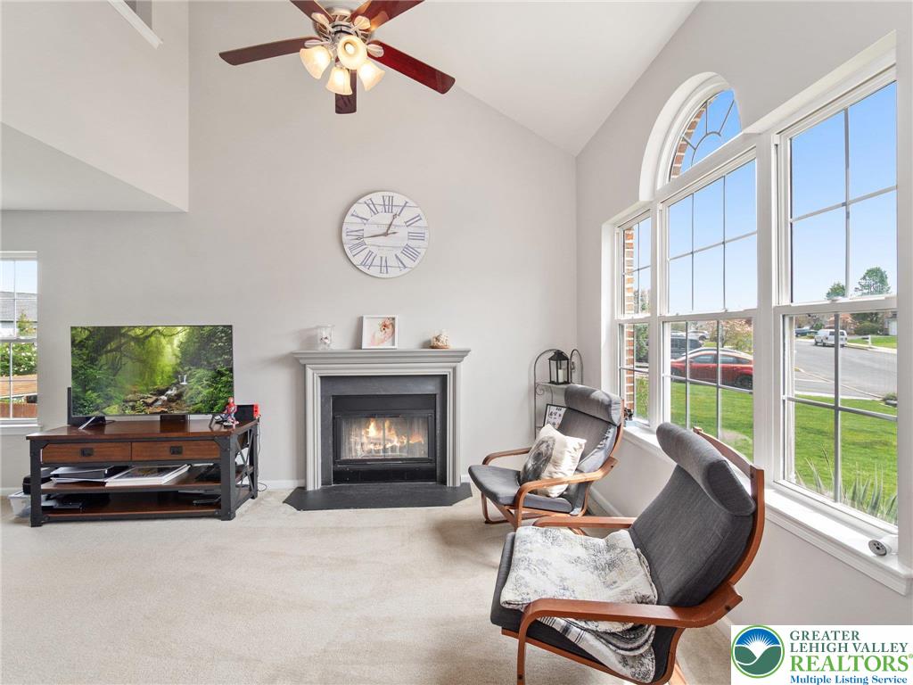 2309 Juniper Drive Coplay, PA 18037 - Photo 27 of 49 a living room with furniture a fireplace and a flat screen tv
