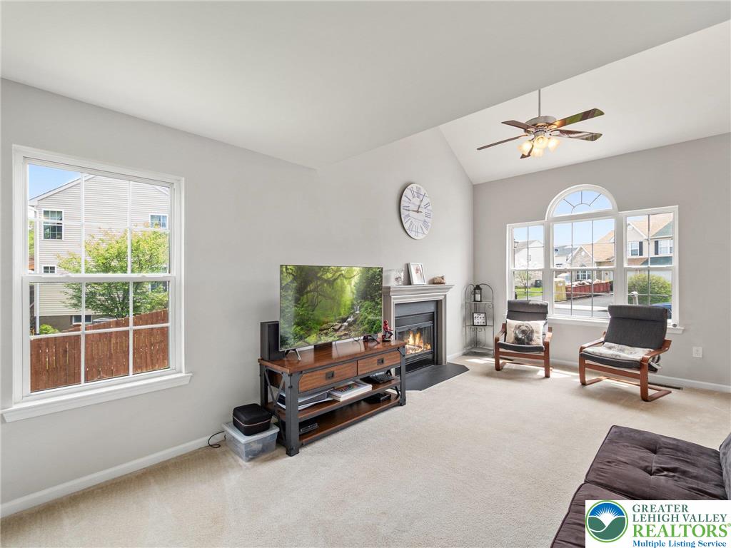 2309 Juniper Drive Coplay, PA 18037 - Photo 28 of 49 a living room with furniture a fireplace and a large window