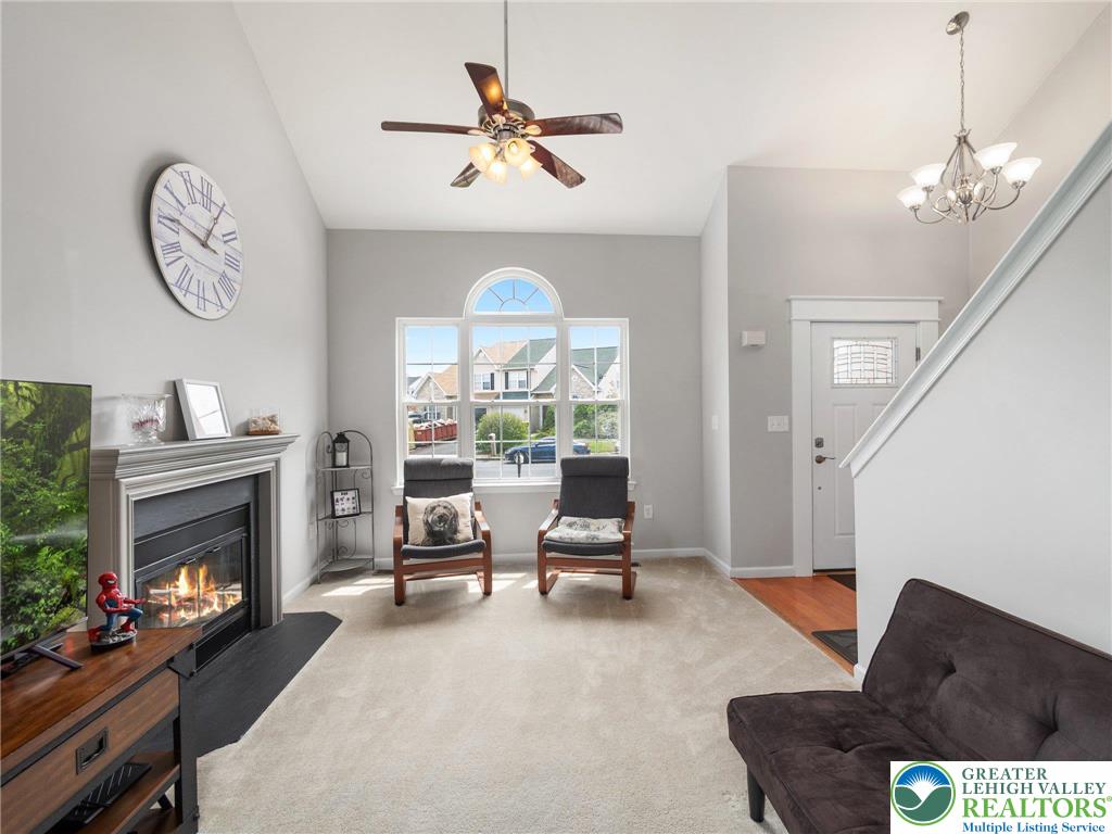 2309 Juniper Drive Coplay, PA 18037 - Photo 29 of 49 a living room with furniture a fireplace and a large window