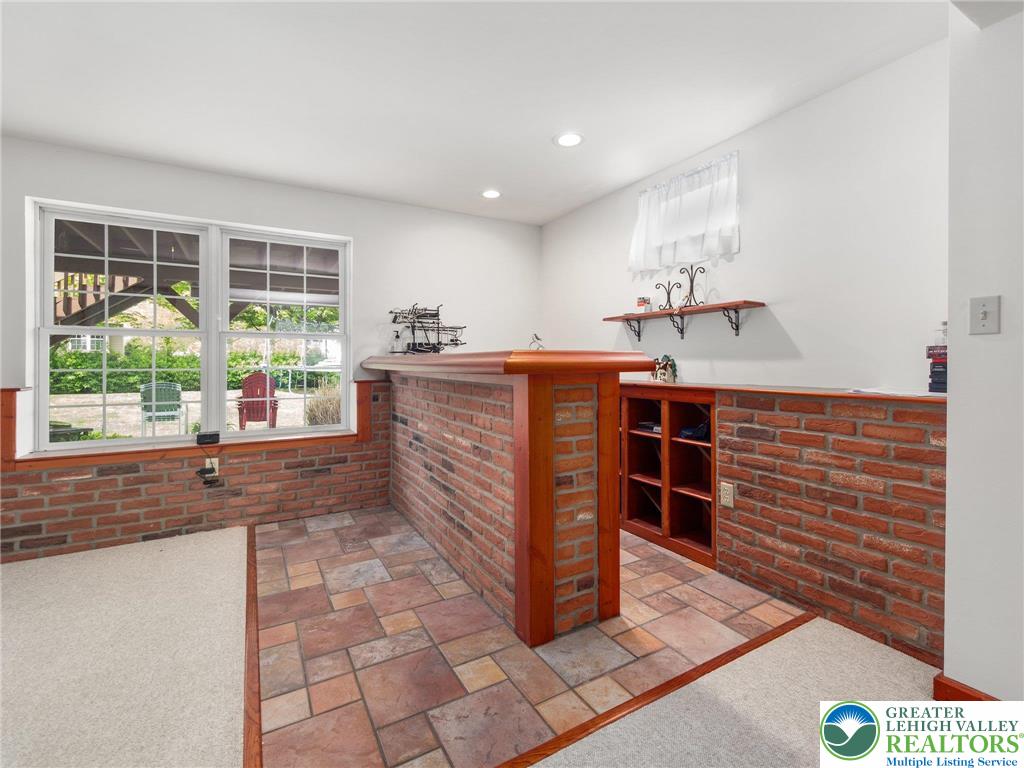 2309 Juniper Drive Coplay, PA 18037 - Photo 38 of 49 a room with wooden cabinets and large windows