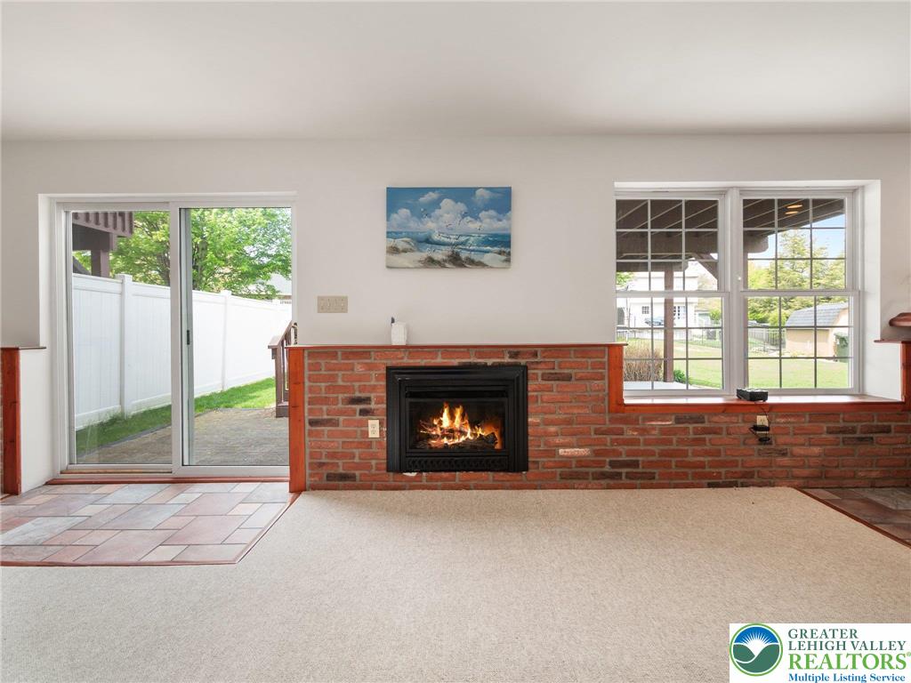 2309 Juniper Drive Coplay, PA 18037 - Photo 41 of 49 a living room with a fireplace and a large window