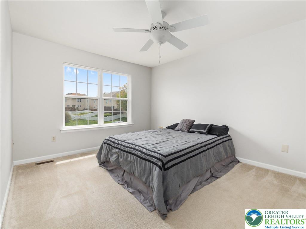 2309 Juniper Drive Coplay, PA 18037 - Photo 45 of 49 a bed sitting in a bedroom next to a window