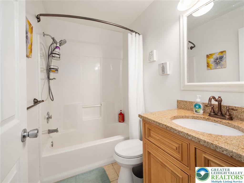 2309 Juniper Drive Coplay, PA 18037 - Photo 47 of 49 a bathroom with a granite countertop sink a toilet and shower