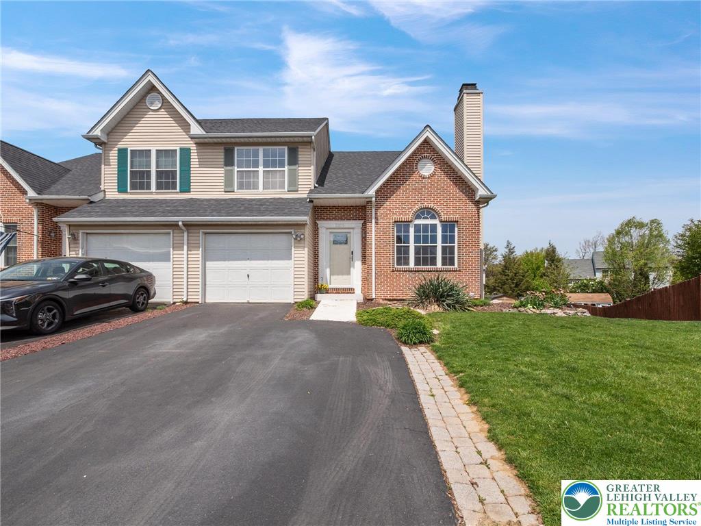 2309 Juniper Drive Coplay, PA 18037 - Photo 5 of 49 a front view of a house with a yard and garage
