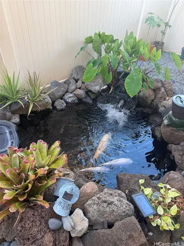 a vase of flowers are sitting on a wooden floor