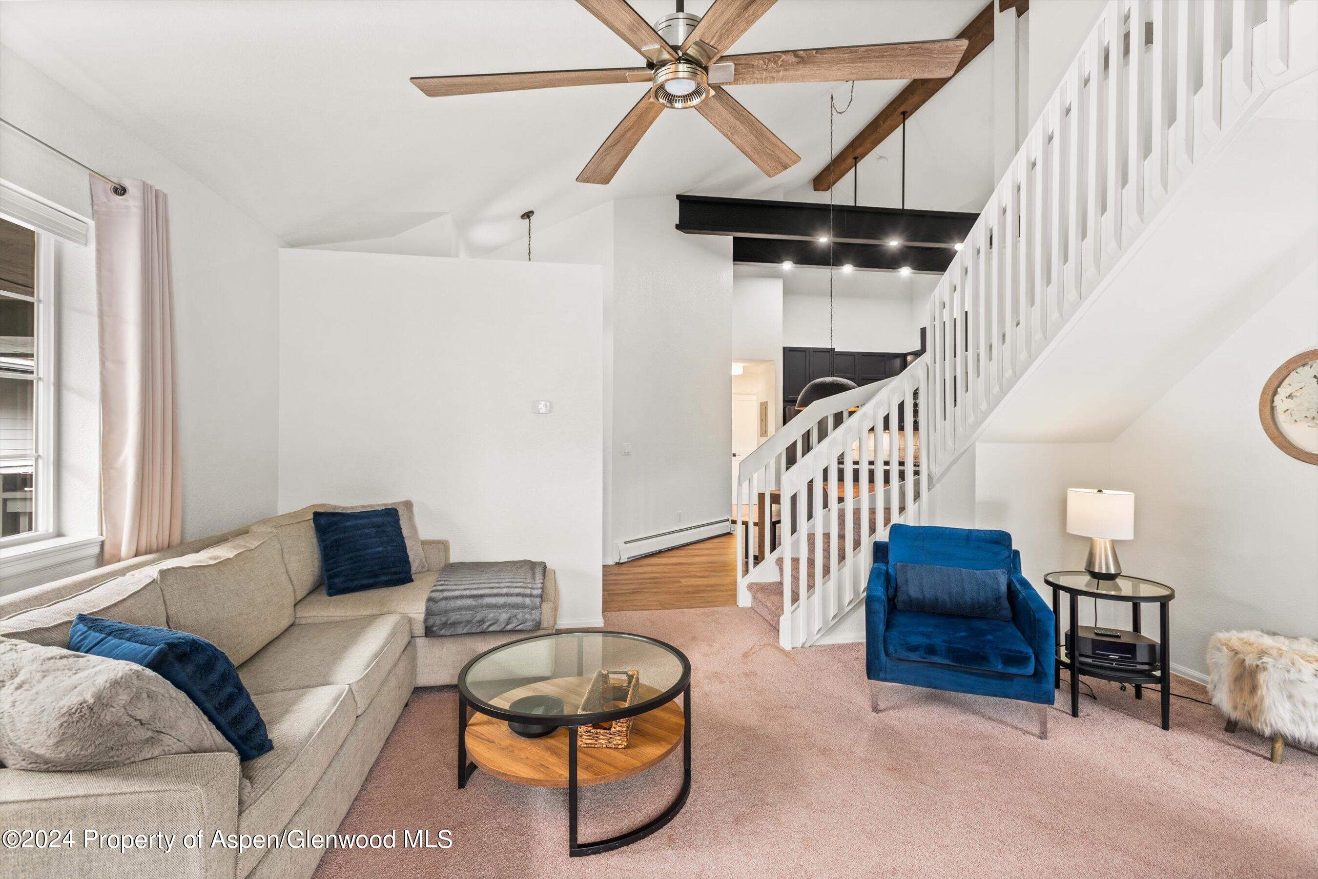 4202 Elk Lane Basalt, CO 81621 - Photo 2 of 15 a living room with furniture and a chandelier