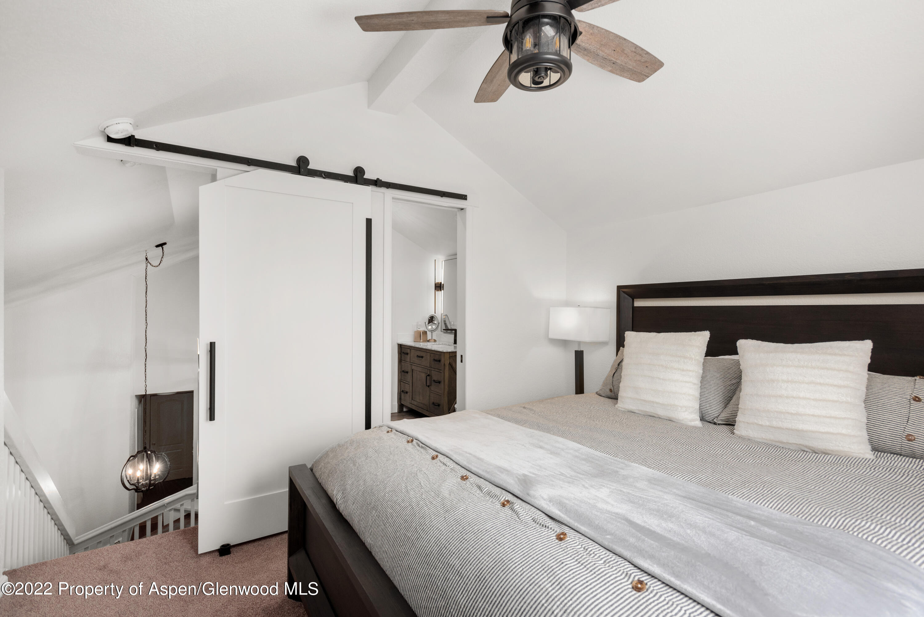 4202 Elk Lane Basalt, CO 81621 - Photo 5 of 15 a bedroom with a bed and a mirror