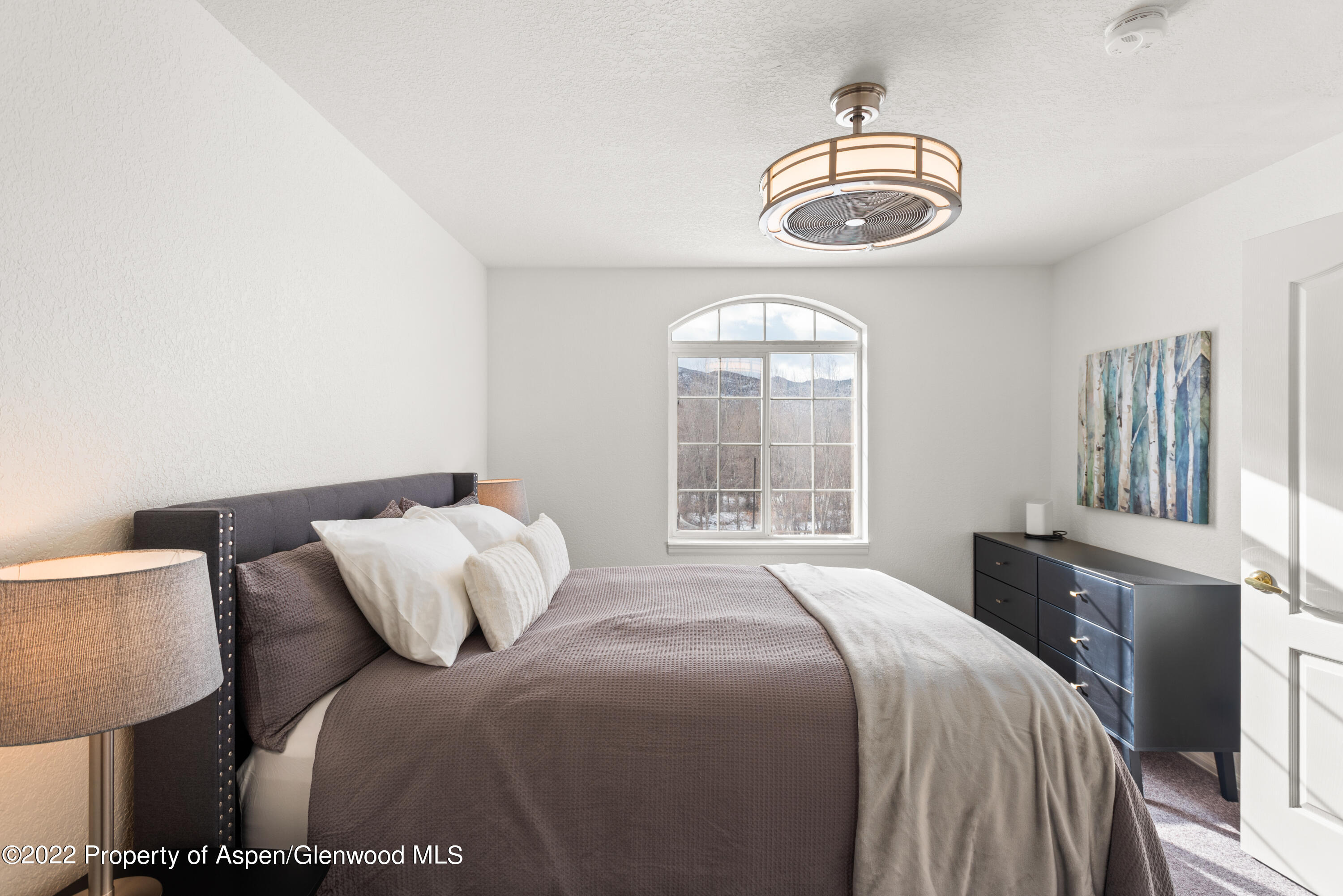 4202 Elk Lane Basalt, CO 81621 - Photo 8 of 15 a bedroom with a bed and a window