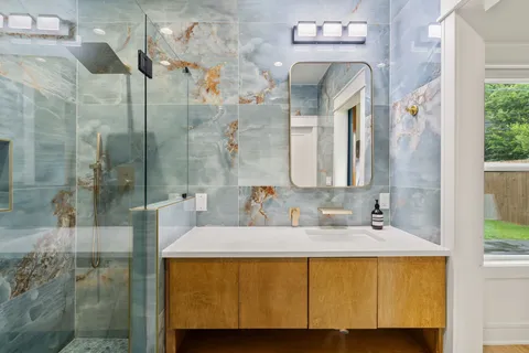 a bathroom with a sink and a mirror