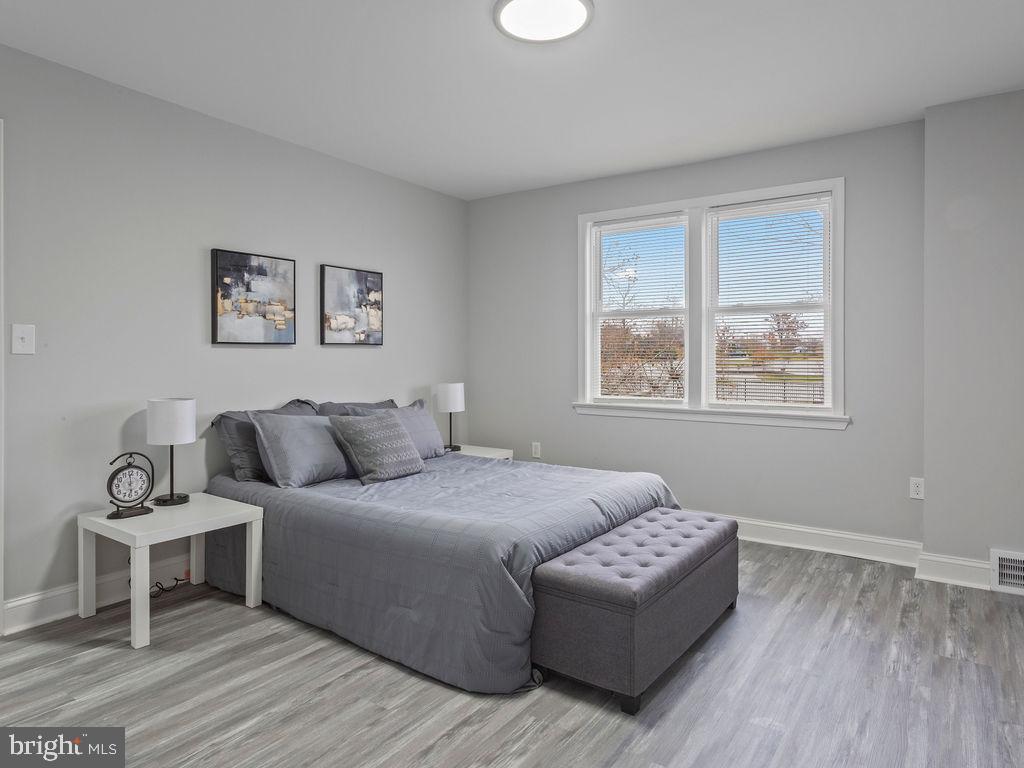 5716 Leith Walk Baltimore, MD 21239 - Photo 14 of 36 a bedroom with a bed and a window