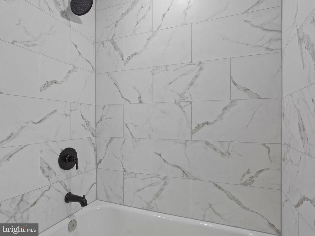 5716 Leith Walk Baltimore, MD 21239 - Photo 18 of 36 a bathroom with a bathtub