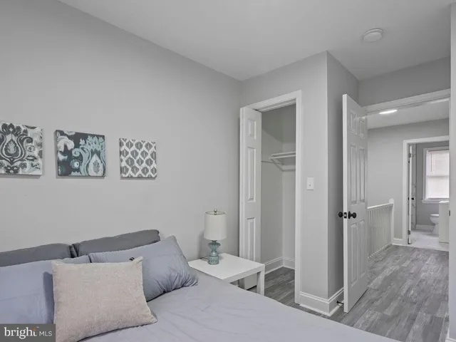 a view of room with wooden floor