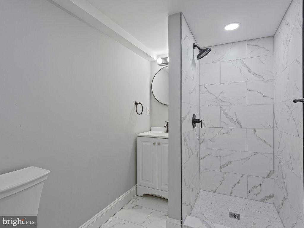 5716 Leith Walk Baltimore, MD 21239 - Photo 24 of 36 a bathroom with a shower and toilet