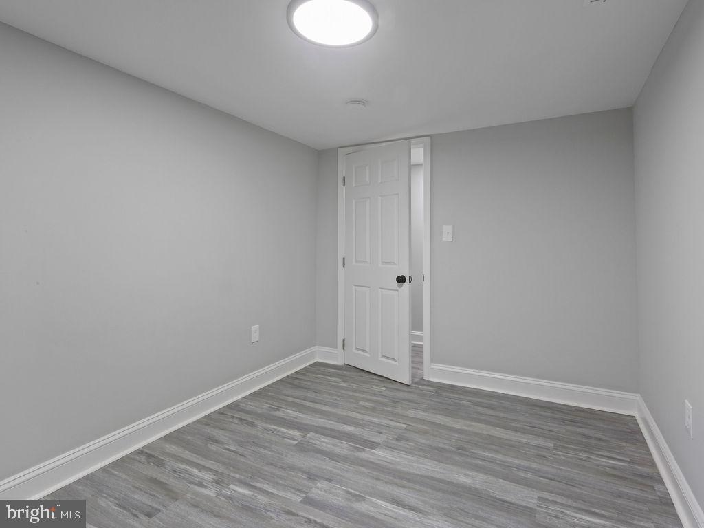5716 Leith Walk Baltimore, MD 21239 - Photo 27 of 36 a view of room with wooden floor