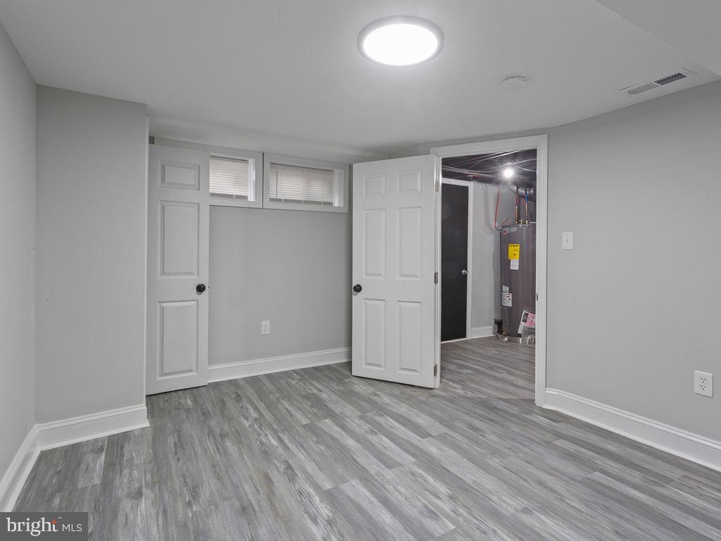 5716 Leith Walk Baltimore, MD 21239 - Photo 30 of 36 wooden floor in an empty room with wooden floor