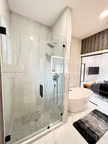 a bathroom with a shower and a sink
