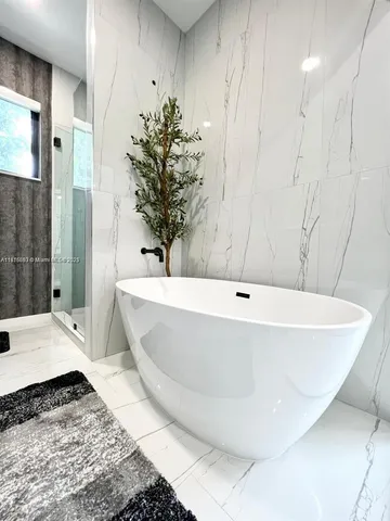a bath tub sitting in a bathroom